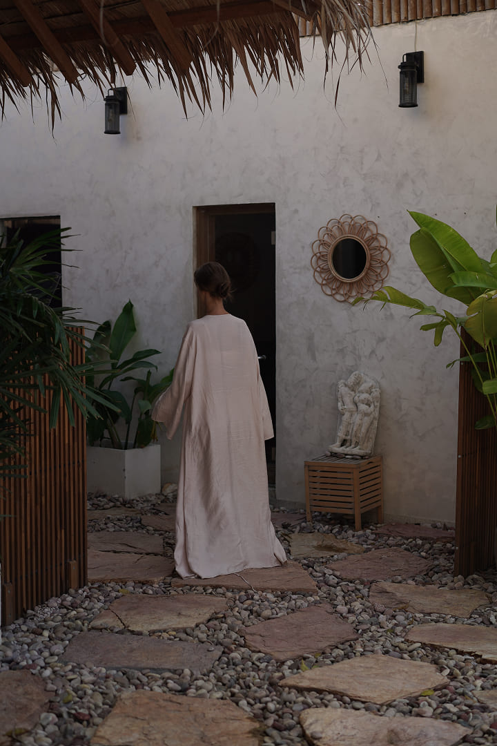 Guest exploring the Maji courtyard garden